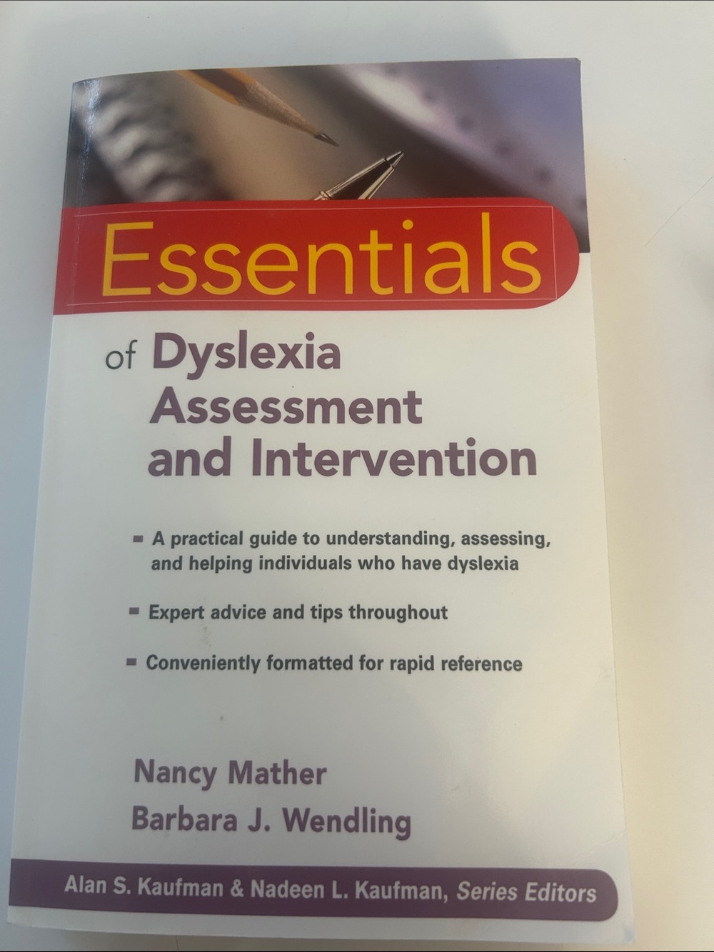 Essentials of Dyslexia Assessment and Intervention - White & Purple Cover